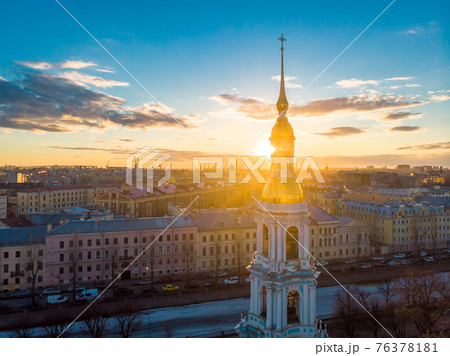 Aerial top view to St. Nicholas Naval Sea Cathedral in sunny day. Panorama of evening historical city center. Orthodox church located on banks of Kryukov and Griboyedov canal. Saint Petersburg. Russia Aerial top view to St. Nicholas Naval Sea Cathedral in sunny day. Panorama of evening historical city center. Orthodox church located on banks of Kryukov and Griboyedov canal. Saint Petersburg. Russia 76378181