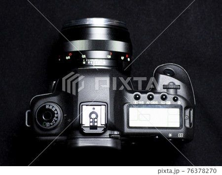 DSLR camera top view on black background DSLR camera top view on black background 76378270