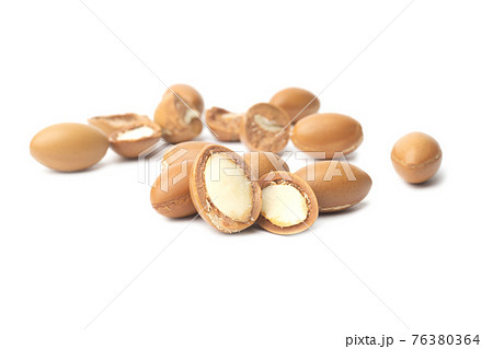 ARGAN SEEDS isolated on a white background. Argan oil and argan nuts concept ARGAN SEEDS isolated on a white background. Argan oil and argan nuts concept 76380364