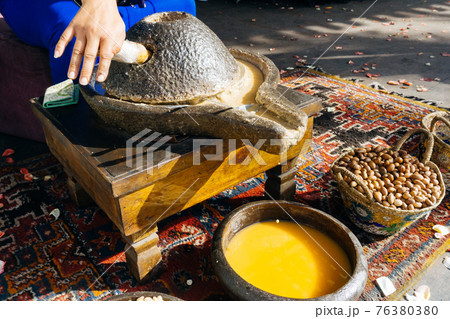 ARGAN OIL. Making of argan oil from argan nuts and seeds in Morocco 76380380