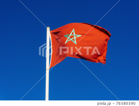 Real flag of morocco on blue sky background 76380390