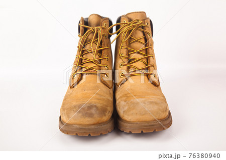 Hiking shoes and a white background, Sturdy hiking boots 76380940