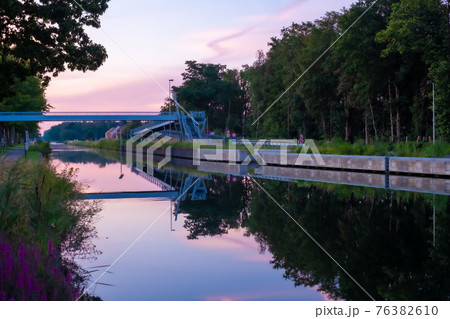 Colourful Sunsets Over a canal or river Colourful Sunsets Over a canal or river 76382610