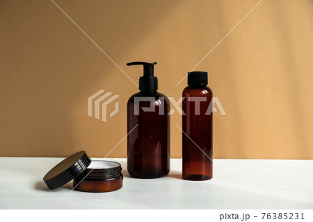 Natural beauty products. Mineral organic oil. Eco cosmetic cream, serum, skin care blank bottle. Natural beauty products. Mineral organic oil. Eco cosmetic cream, serum, skin care blank bottle. 76385231