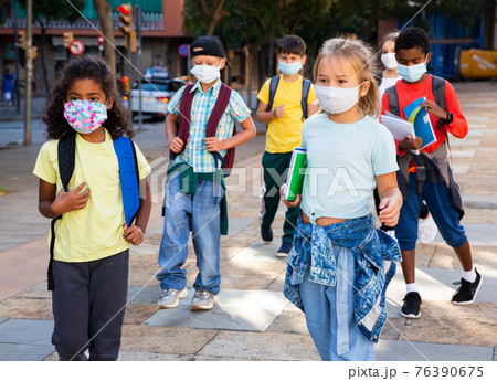 Children in masks going to school Children in masks going to school 76390675
