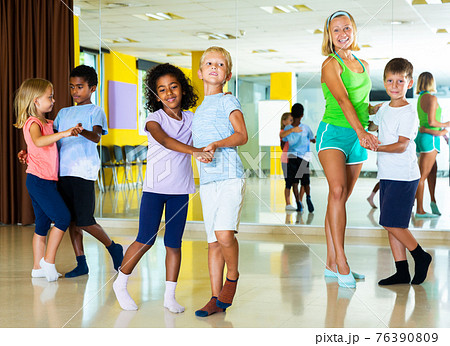 Preteen kids training in dance studio 76390809