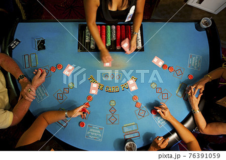 People playing poker in casino 76391059