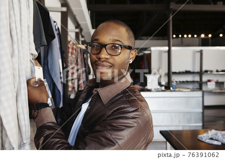 African American man shopping in clothing store 76391062