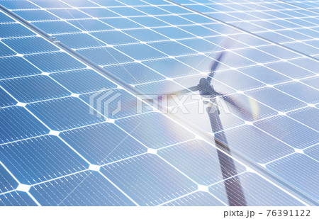 Wind turbine reflected in solar panels Wind turbine reflected in solar panels 76391122