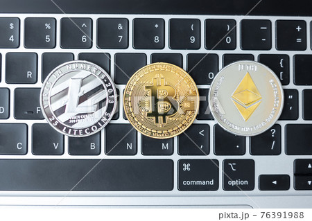 golden and silver Cryptocurrency on keyboard laptop, Bitcoin , Ethereum, Litecoin coins. Crypto is Digital Money within the blockchain network golden and silver Cryptocurrency on keyboard laptop, Bitcoin , Ethereum, Litecoin coins. Crypto is Digital Money within the blockchain network 76391988