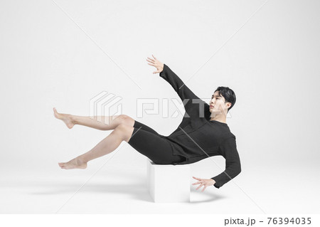 contemporary asian male dancer making move in white background contemporary asian male dancer making move in white background 76394035