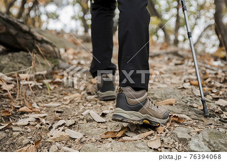 Asian handsome man trekking, climbing autumn mountain 76394068
