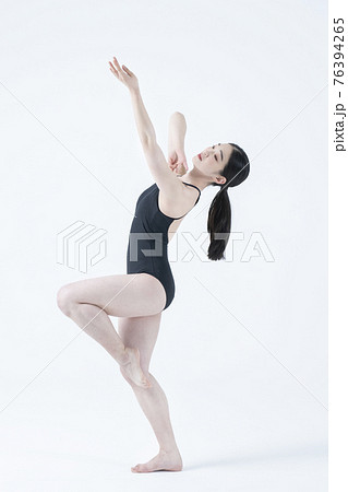 contemporary Asian female dancer making move in white background contemporary Asian female dancer making move in white background 76394265
