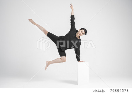 contemporary asian male dancer making move in white background contemporary asian male dancer making move in white background 76394573