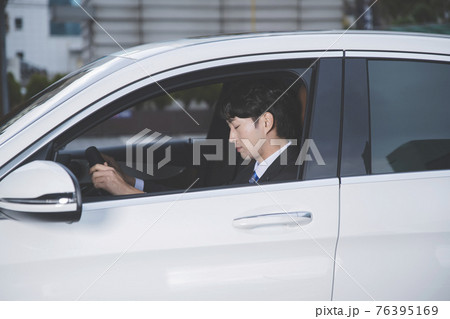 Asian male in suit in the car, drowsy driving concept Asian male in suit in the car, drowsy driving concept 76395169