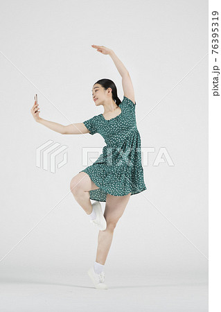 sale promotion concept, contemporary female dancer with smarphone on hand sale promotion concept, contemporary female dancer with smarphone on hand 76395319