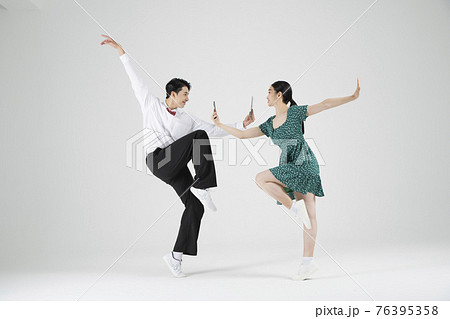 sale promotion concept, contemporary couple dancers with smarphone on hand sale promotion concept, contemporary couple dancers with smarphone on hand 76395358