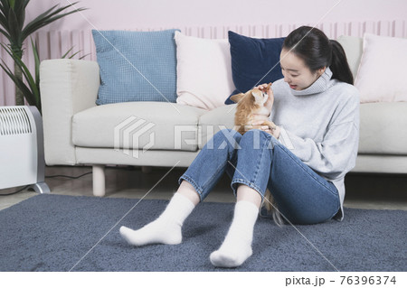 Asian single solo woman living alone concept with pet dog 76396374