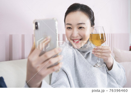Asian single solo woman enjoying home alone time concept Asian single solo woman enjoying home alone time concept 76396460