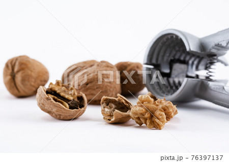walnuts and nutcracker 76397137