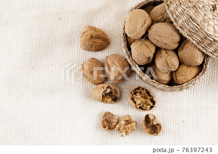 walnuts in woven basket walnuts in woven basket 76397243