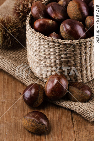 chestnuts on woven cloth, basket chestnuts on woven cloth, basket 76397289