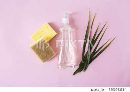 Soap dropper, dishwashing liquid, dish soap, washcloth. Pink, yellow background Soap dropper, dishwashing liquid, dish soap, washcloth. Pink, yellow background 76398814
