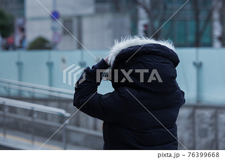 cold weather, winter street with people 76399668