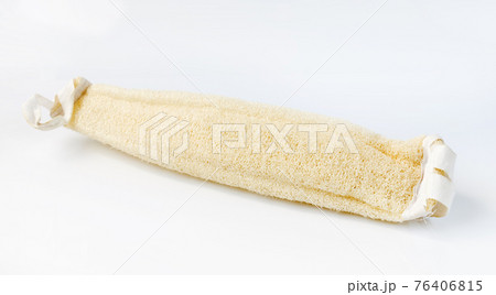 Natural loofah scrubber on a light background 76406815