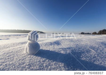 one small snowman in the winter season, close up one small snowman in the winter season, close up 76406937