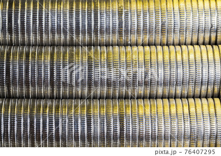 many round metal coins of silver color illuminated with Golden color many round metal coins of silver color illuminated with Golden color 76407295