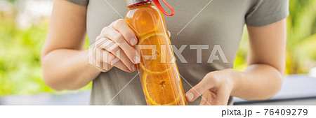 Homemade Fermented Raw Kombucha Tea Ready to Drink With orange and lime. Summer BANNER, LONG FORMAT Homemade Fermented Raw Kombucha Tea Ready to Drink With orange and lime. Summer BANNER, LONG FORMAT 76409279