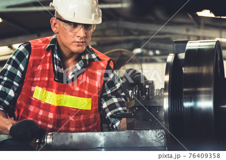 Smart factory worker or engineer do machine job in a manufacturing workshop Smart factory worker or engineer do machine job in a manufacturing workshop 76409358