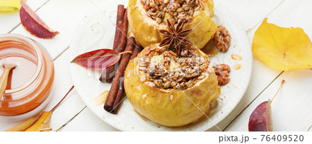 Fruit dessert baked apples 76409520