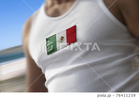 The national flag of Mexico on the athlete's chest The national flag of Mexico on the athlete's chest 76411239