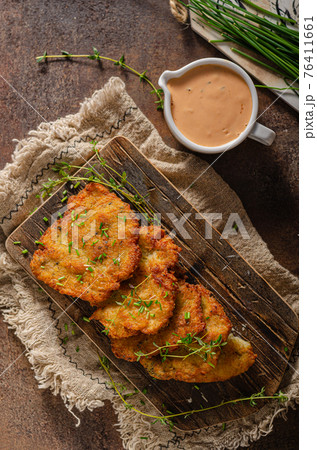 Homemade latkes with herbs 76411661