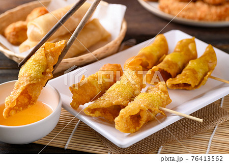 Asian deep fried crispy wonton stuffed with minced pork, quail egg and shrimp 76413562