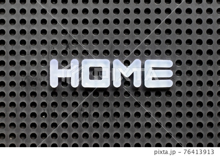 White color letter in word home on black pegboard background 76413913