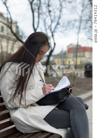 SME Businesswoman's hand with pen completing personal information on form SME Businesswoman's hand with pen completing personal information on form 76414312