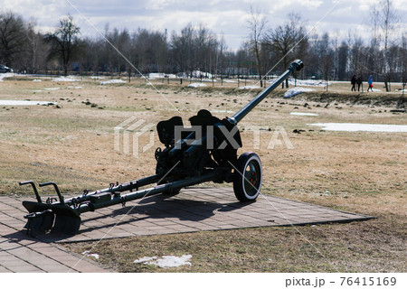 View of the russian cannons and howitzers in a park. Military museum outdoors View of the russian cannons and howitzers in a park. Military museum outdoors 76415169