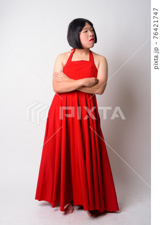 Full body shot of angry young gay Asian man looking upset Full body shot of angry young gay Asian man looking upset 76421747