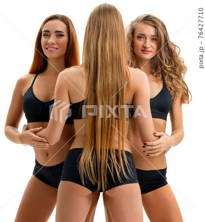 Pretty sportswomen in tops and pants pose in stidio Pretty sportswomen in tops and pants pose in stidio 76427710