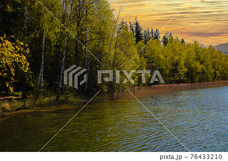 View of a small lake in the countryside. View of a small lake in the countryside. 76433210