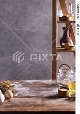 Bakery ingredients for homemade bread cooking or baking on table. Bread set at wooden tabletop Bakery ingredients for homemade bread cooking or baking on table. Bread set at wooden tabletop 76438809