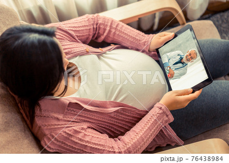 Doctor telemedicine service online video with pregnant woman for prenatal care Doctor telemedicine service online video with pregnant woman for prenatal care 76438984