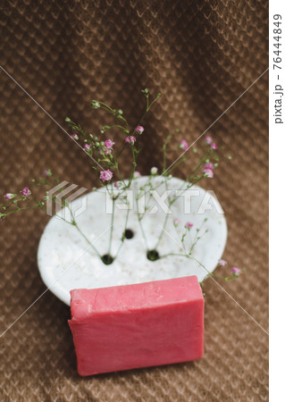 Natural handmade soap bar with ceramic soap dish and flowers, spa organic soap, sustainable lifestyle Natural handmade soap bar with ceramic soap dish and flowers, spa organic soap, sustainable lifestyle 76444849