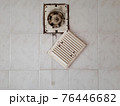 Dirty ventilation air grille with fan at home close up on white wall. Dust condition technology, dangerous old house air circulation system. Bad filtration indoors. Horizontal concept 76446682