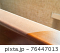 Close up of dust on wooden furniture at home. dirty and clear parts of desk. Domestic hygiene and allergy concept. Dusty texture 76447013