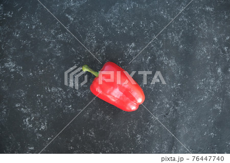 bulgarian red pepper. On a blue background of oil paint. Food background 76447740