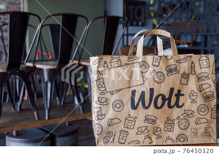 Wolt food delivery bag with company logo, on restaurant. Wolt food delivery bag with company logo, on restaurant. 76450320